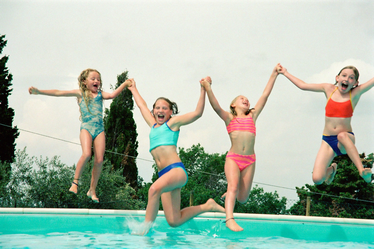 Girls playing at the pool